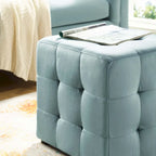 Pouf cube capitonné en velours